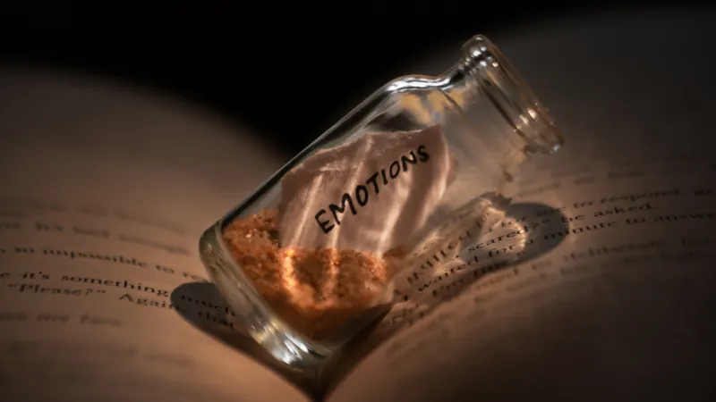 A small glass jar resting on the pages of an open book in warm lamplight, the one life story a person has full access to and has never opened